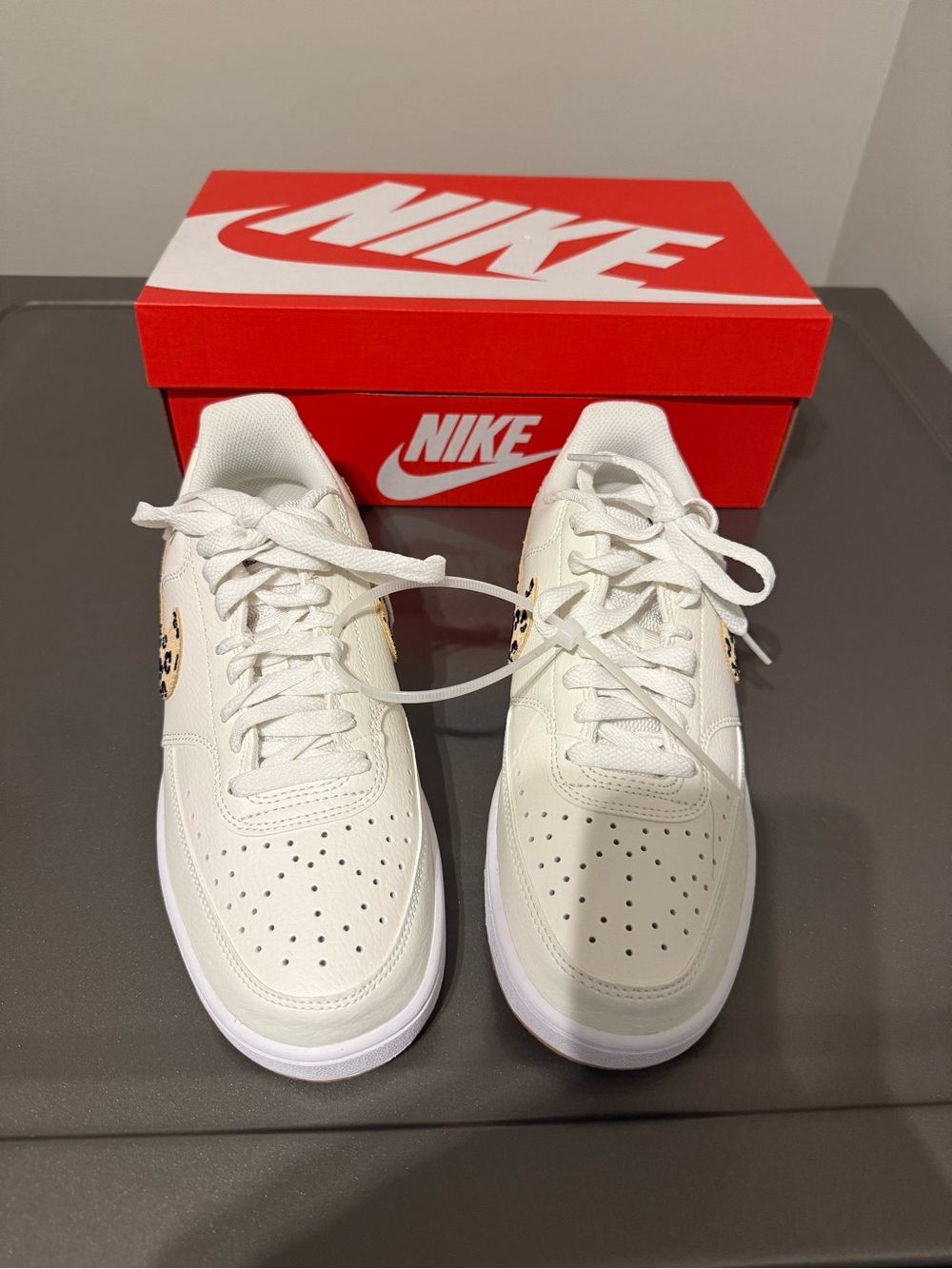 Nike White Low-Top Sneakers with Leopard Swoosh Accent- Women’s size 9